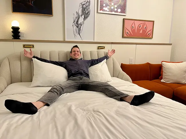 Andy enjoying the bed at Virgin Hotels Las Vegas