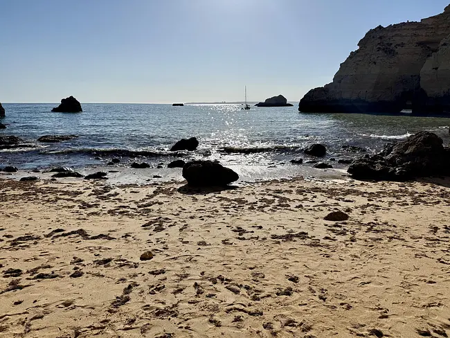 Sun glistening on the ocean at Praia João de Arens