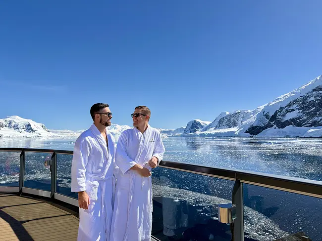 Trai & Andy in their robes aboar the Seabourn Pursuit in Antarctica