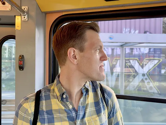 Andy looking out the window of a Zurich tram