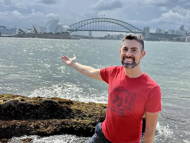 Trai in front of the Sydney Harbour and Opera House and Harbour Bridge