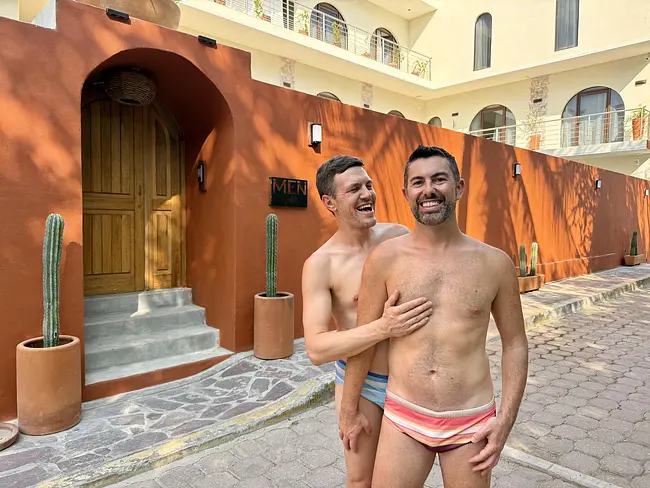 Andy & Trai laughing in front of the entrance to Men Zipolite