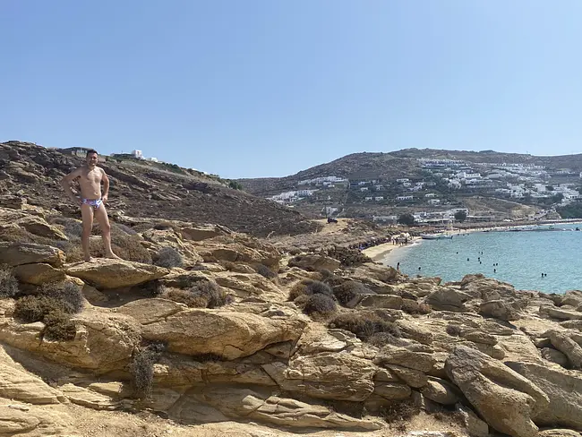 Andy at the rocks above Elia Beach in Mykonos, Greece