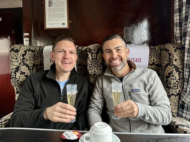 Andy & Trai enjoying bubbles aboard The Jacobite