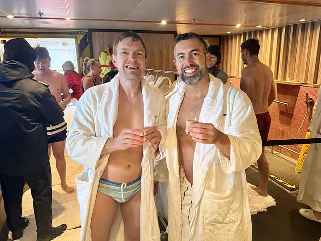 Andy & Trai enjoying a drink after the Polar Plunge on Seabourn Pursuit