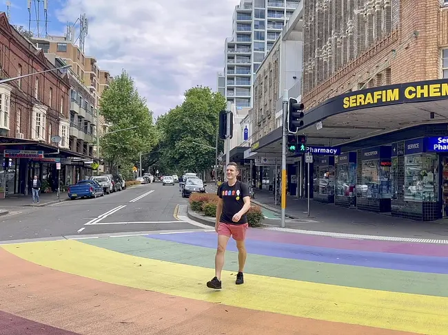Andy walking through Rainbow Crosswalk in Darlinghurst