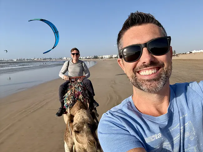 Trai and Andy on a Sunset Camel Ride along the beach