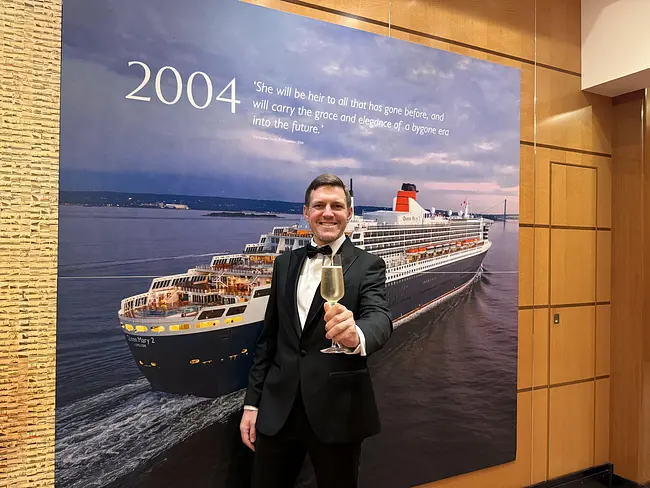 Andy at Gala Night with Champagne aboard the Queen Mary 2