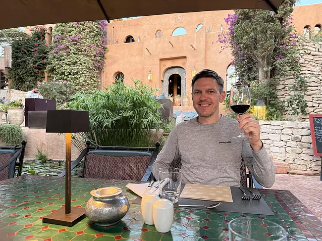 Andy enjoying a glass of wine at dinner at Le Jardin des Douars