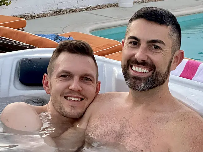 Andy and Trai Enjoying the Hot Tub at Sunset